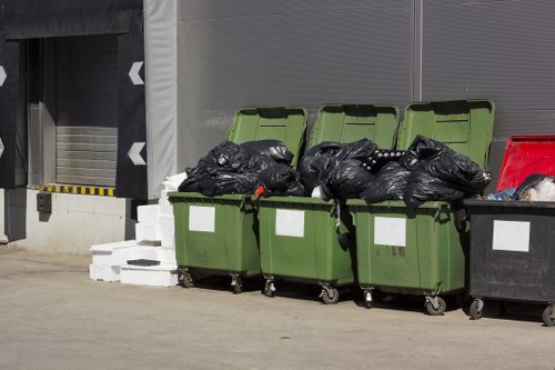 Workers loading mixed office waste into a van during a Mottingham office clearance